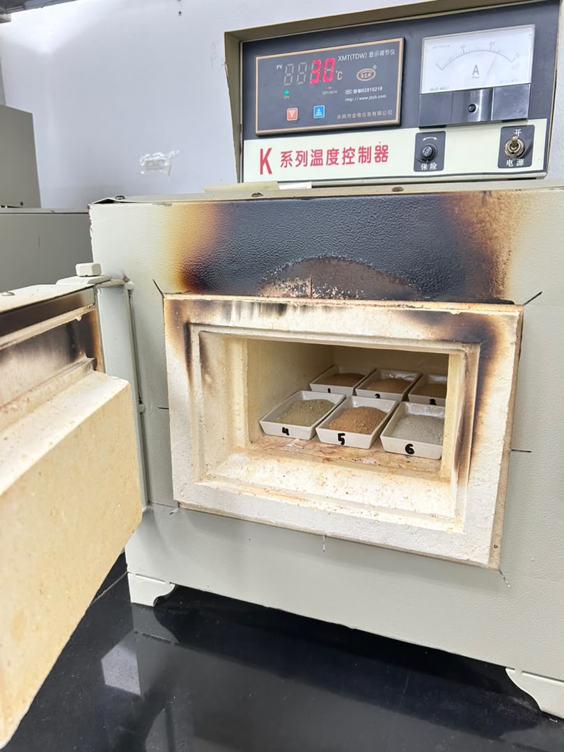 Laboratory furnace with labelled geological sample trays